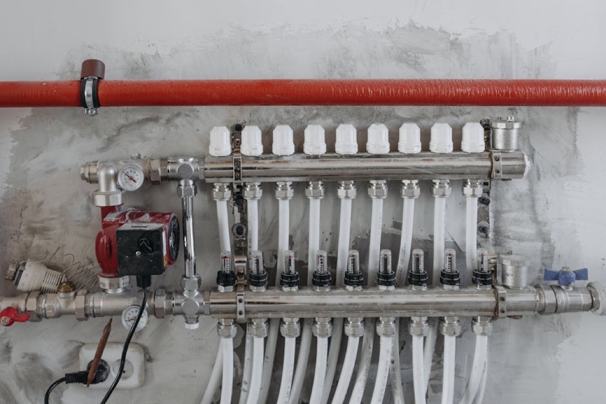 Navien flame rod removed from tankless water heater for inspection and cleaning