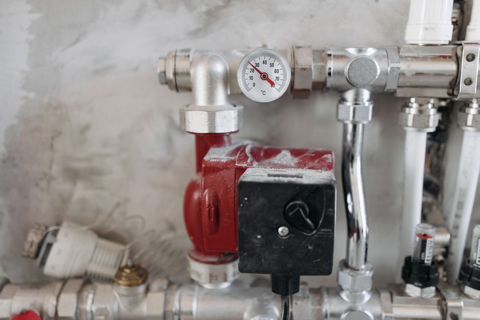 Diagram showing recirculation pump routing under a sink and back to the water heater