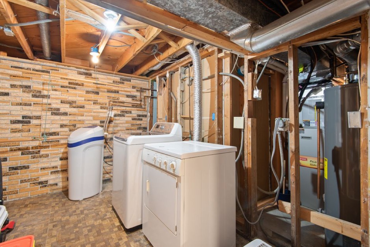Licensed plumber installing 3/4-inch gas line for tankless water heater retrofit
